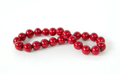 vintage red beads coloured in red isolated on white background w