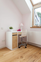 Fototapeta na wymiar Desk with chair in bright room
