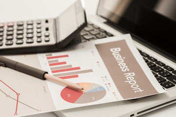 Businessman analyzing investment charts with laptop. Accounting