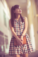 Portrait of smiling woman hold book