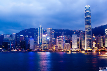 Hong Kong city skyline at night over Victoria Harbor