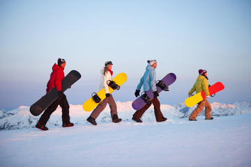 Group of snowboarders on top of the mountain