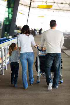 young family at airport