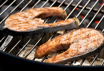 Delicious salmon cutlet steaks on the grill