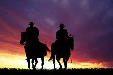 Fototapeta na wymiar cowboys at sunset