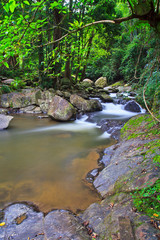 Naklejka na ściany i meble Waterfall in the rain forest, Thailand