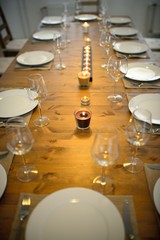 Fototapeta na wymiar Covered dining table with wine glasses