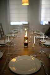 Covered dining table with wine glasses