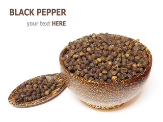 Black pepper in wooden bowl isolated on white background
