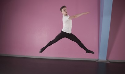Focused male ballet dancer leaping