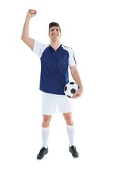 Football player in blue celebrating