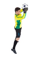Goalkeeper in yellow making a save