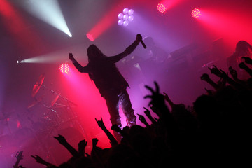 Concert photo of male singer holding microphone