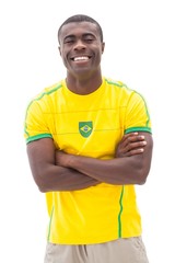 Happy brazilian football fan smiling at camera