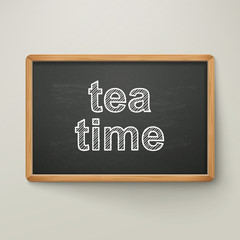 tea time on blackboard in wooden frame
