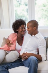 Happy couple relaxing on the couch