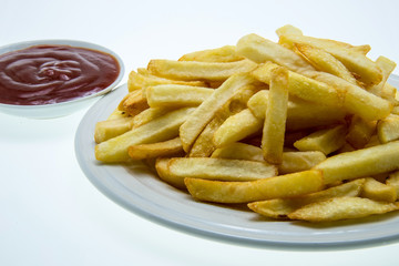 French fries with ketchup on white background