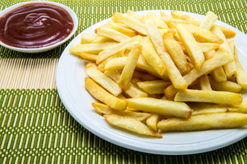 French fries with ketchup on plate