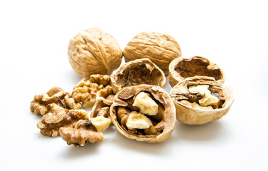 walnut and a cracked walnut on the white background
