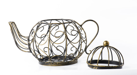Metal wireframe teapot on white