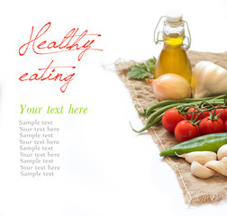 Tomatoes, green beans, onion, paprika, garlic and olive oil on a