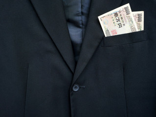 business suit and Japan bills in the pocket