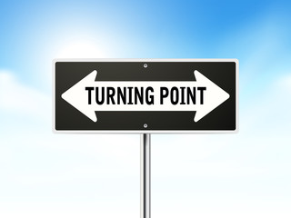turning point on black road sign