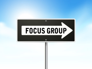 focus group on black road sign