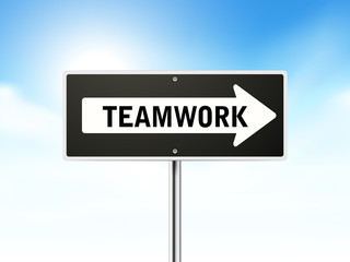 teamwork on black road sign