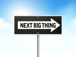 next big thing on black road sign