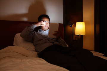 Fototapeta premium Tablet pc will hurt your eyes in the dark