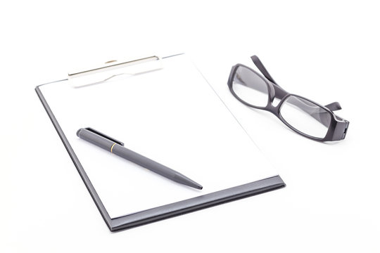 Clipboard black color and glasses, pen.