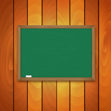 Blackboard and chalk  on background a wooden wall