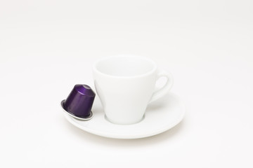 Fototapeta na wymiar Coffee cup with capsule