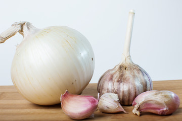 onion and garlic on a white background