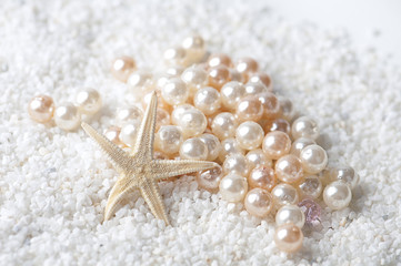 starfish with pearls in the sand
