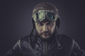 usaf pilot dressed in vintage style leather cap and goggles