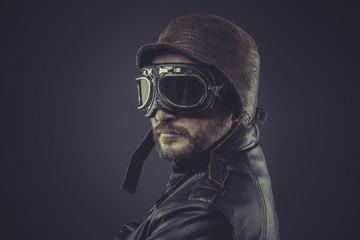 sensual, pilot dressed in vintage style leather cap and goggles - obrazy, fototapety, plakaty