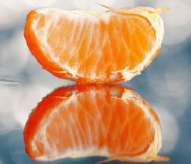mandarin oranges and cloves on blurred background freshness