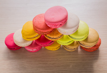 French colorful macarons on wood table