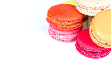 French colorful macarons on white background