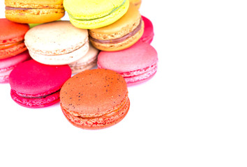 French colorful macarons on white background