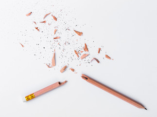 Broken Pencil on white paper