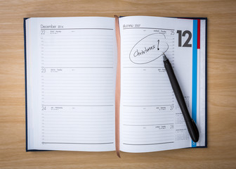 Note Book on Wooden Table  with word 