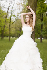 Beautiful bride with stylish make-up in white dress