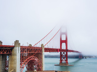 Golden Gate Bridge is covered by fog in San Francisco - 68545733