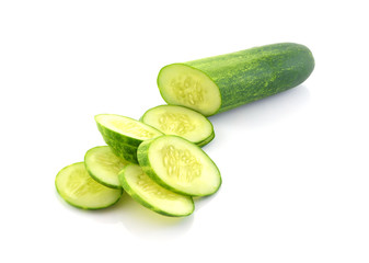 Cucumber and slices isolated over white background.