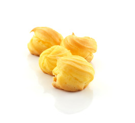 Cream puffs on white background