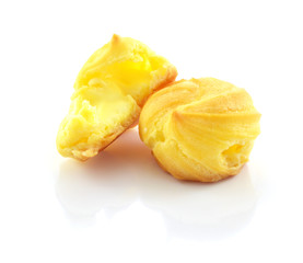 Cream puffs on white background