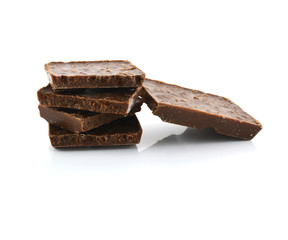 Closeup detail of chocolate parts on white background.